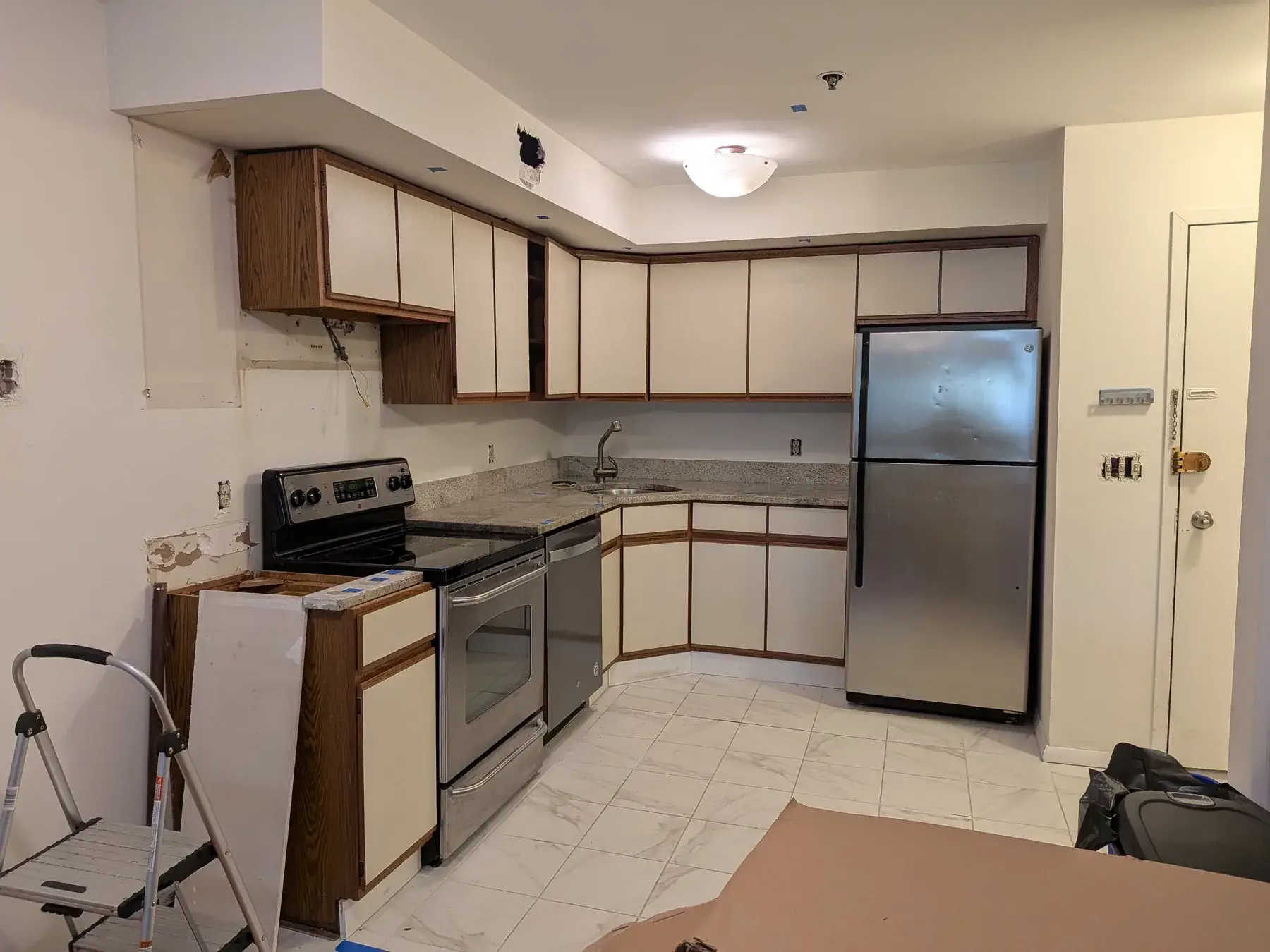 The old kitchen with its appliances still in place, ahead of demolition