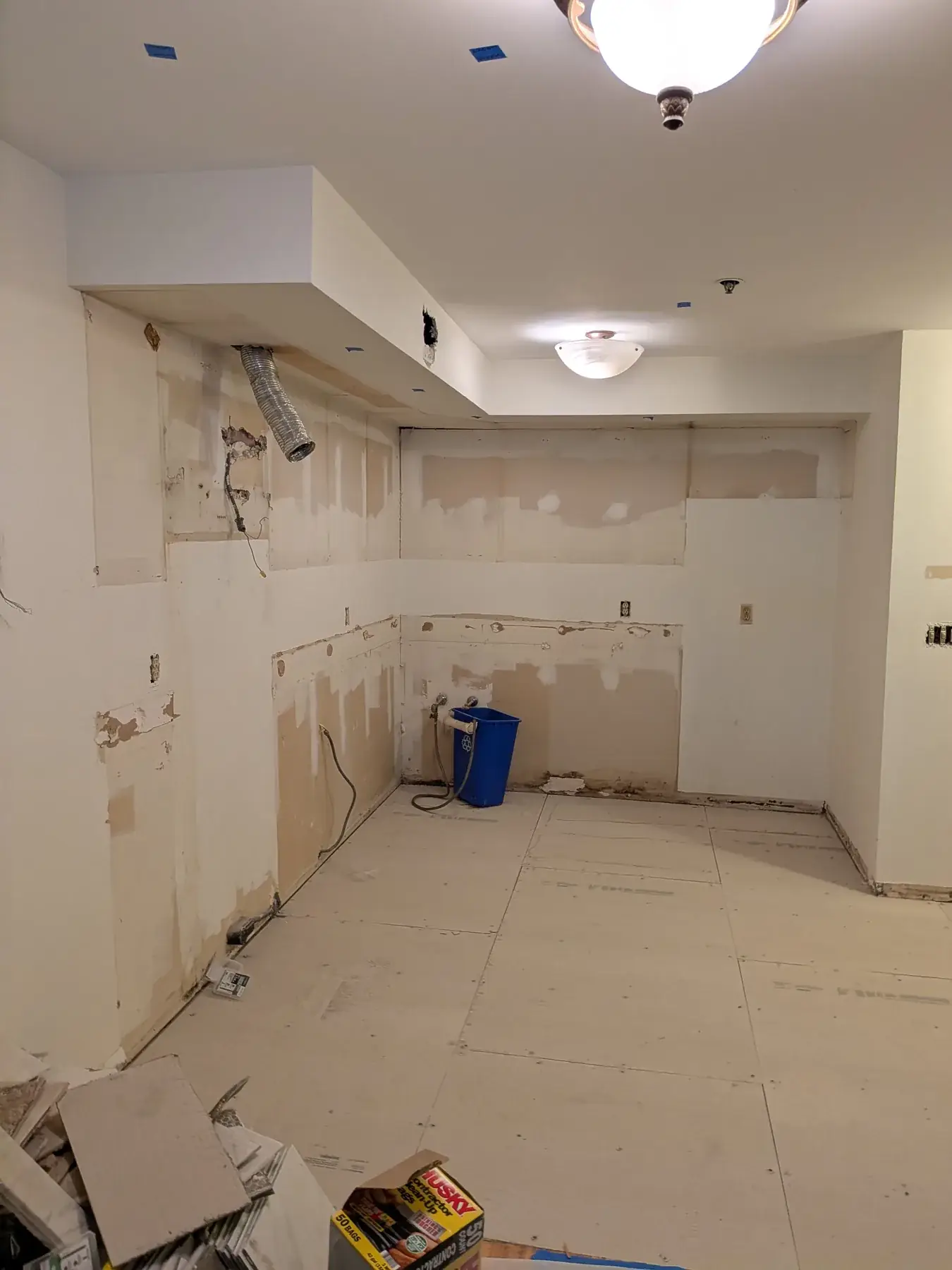 The kitchen stripped back to bare walls after demolition
