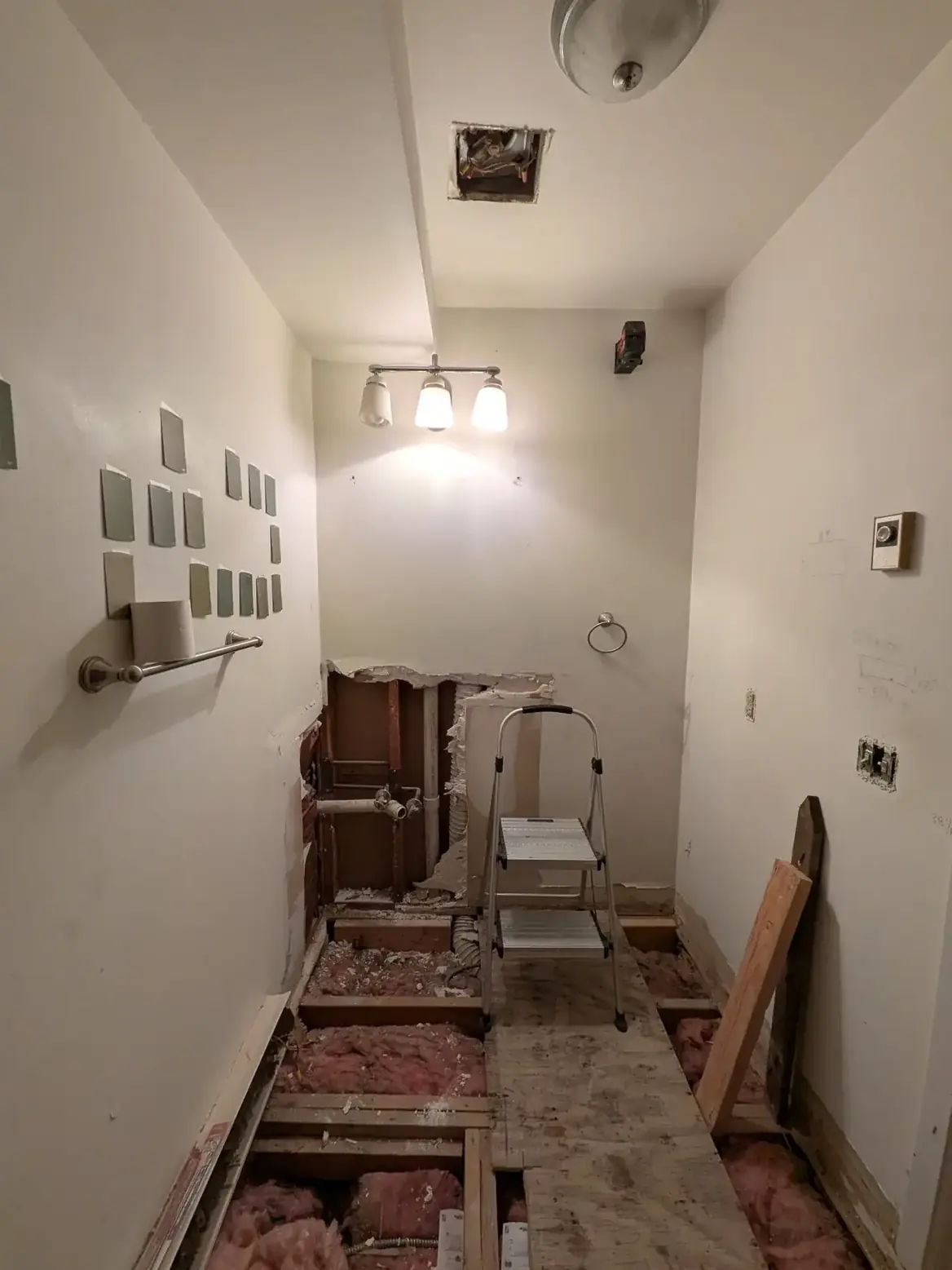 Floor joists exposed along the hallway during levelling