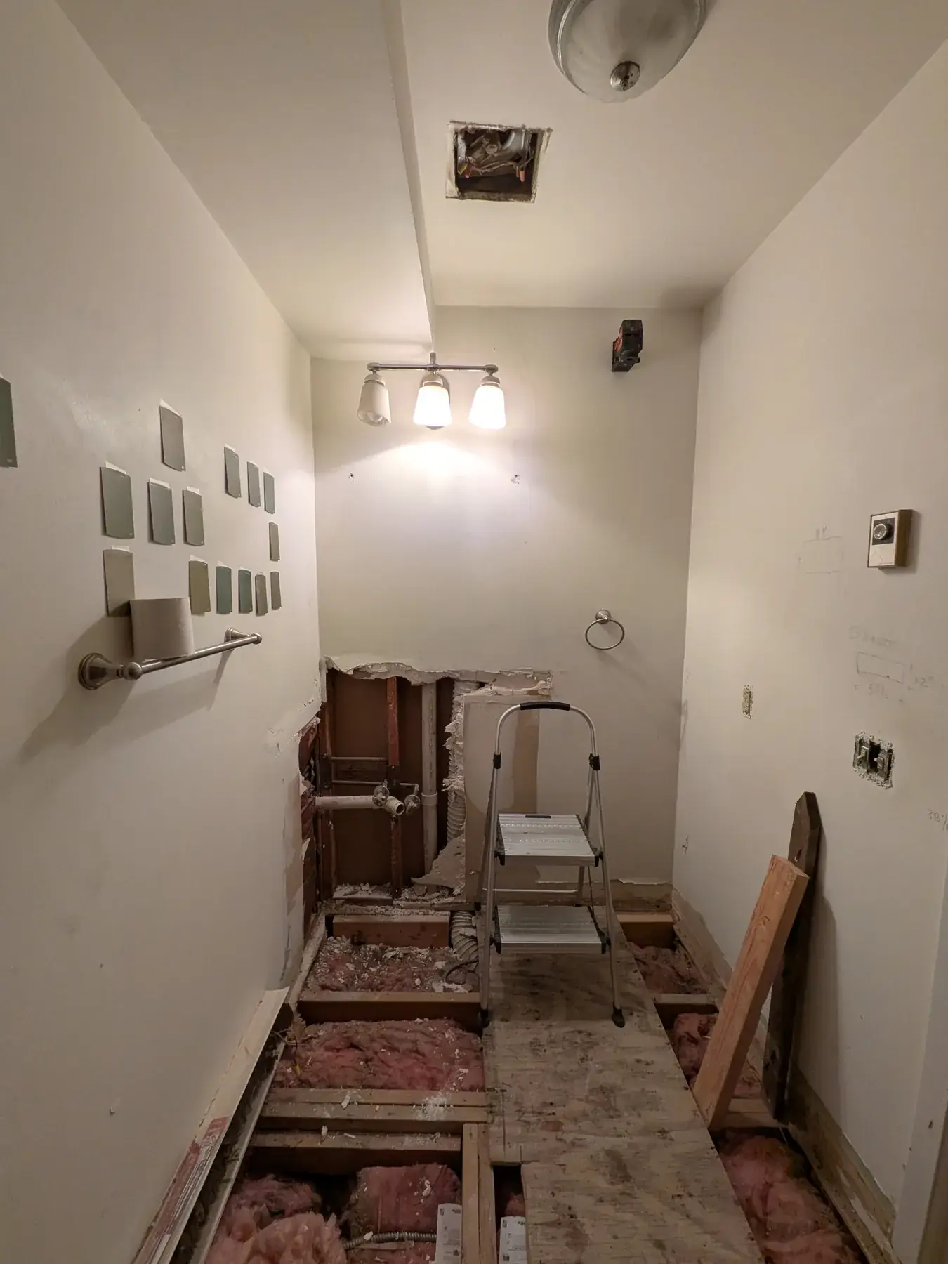 Floor joists exposed along the hallway during levelling