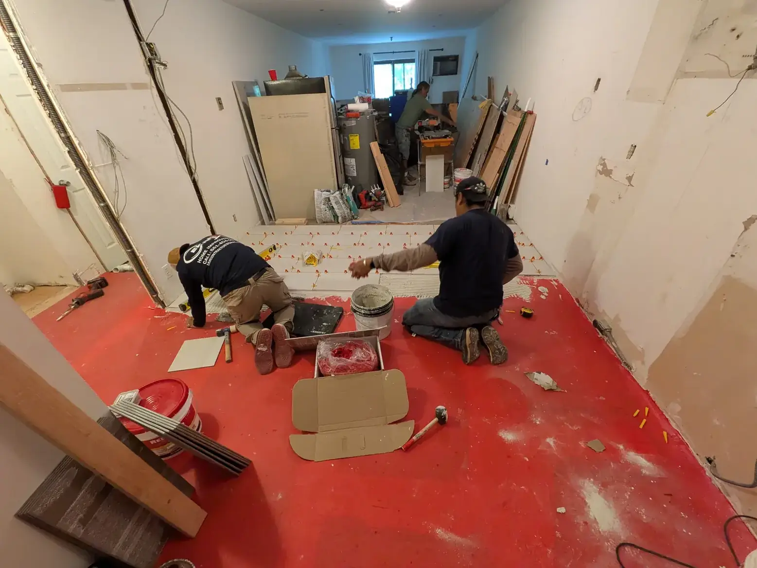 Uncoupling membrane laid across the levelled subfloor before tiling