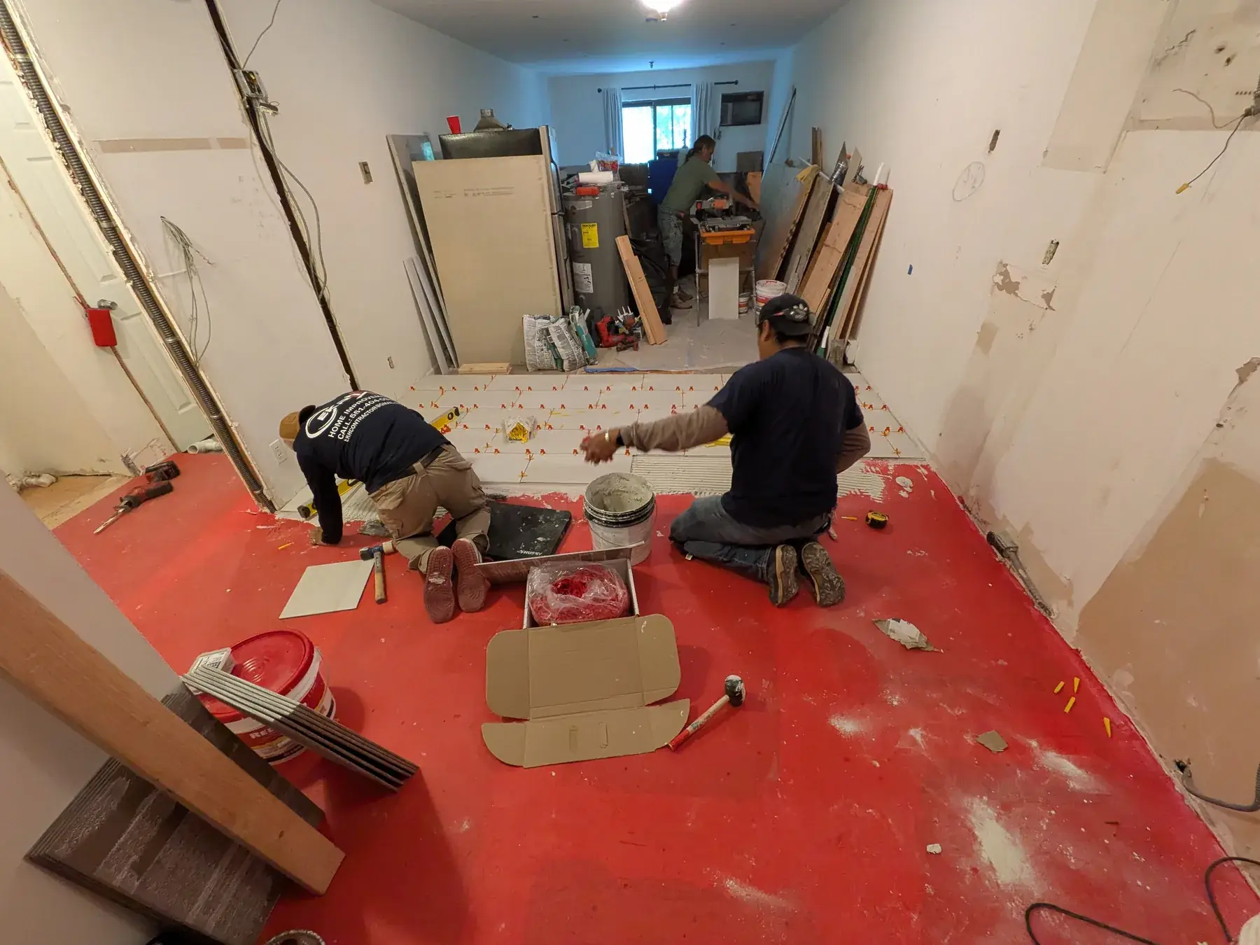 Uncoupling membrane laid across the levelled subfloor before tiling