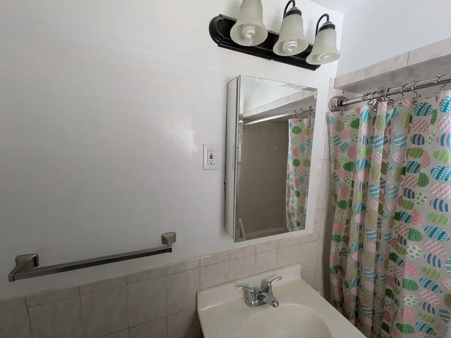 The original vanity, mirror and light fitting