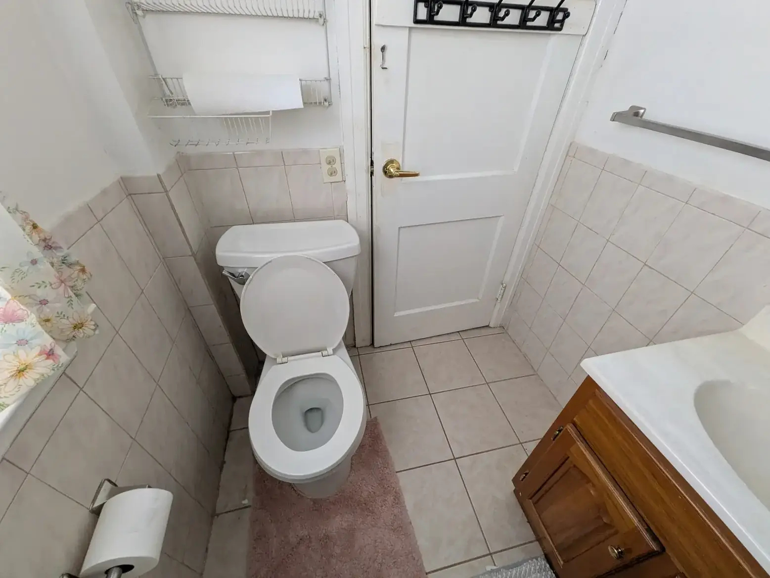 The original toilet and floor tile before demolition