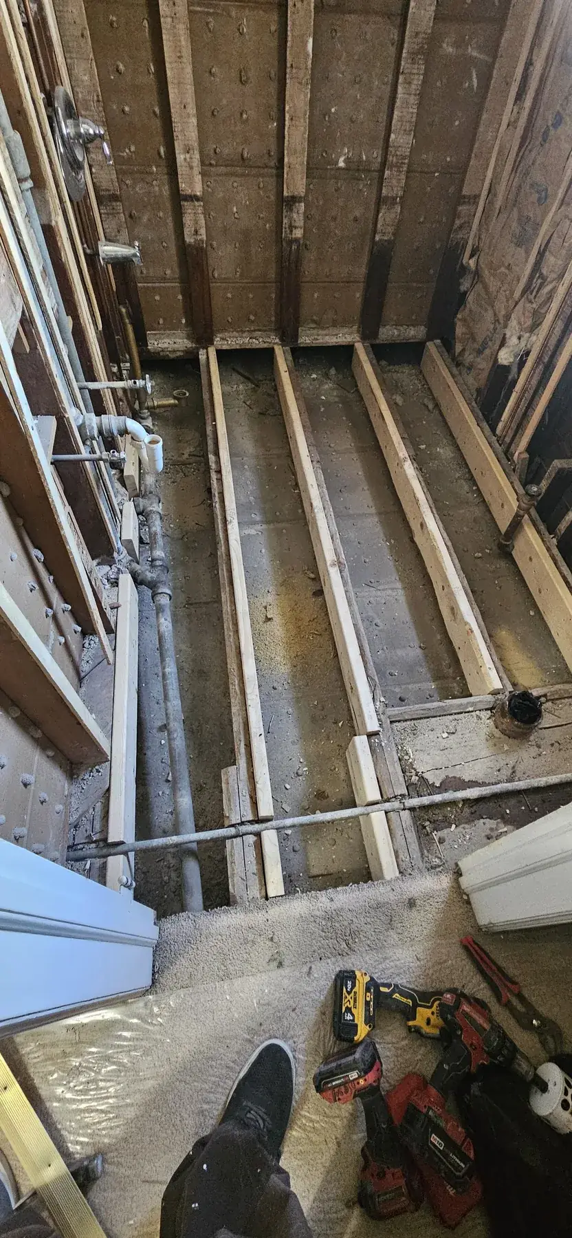 The new floor framing laid in over the levelled joists